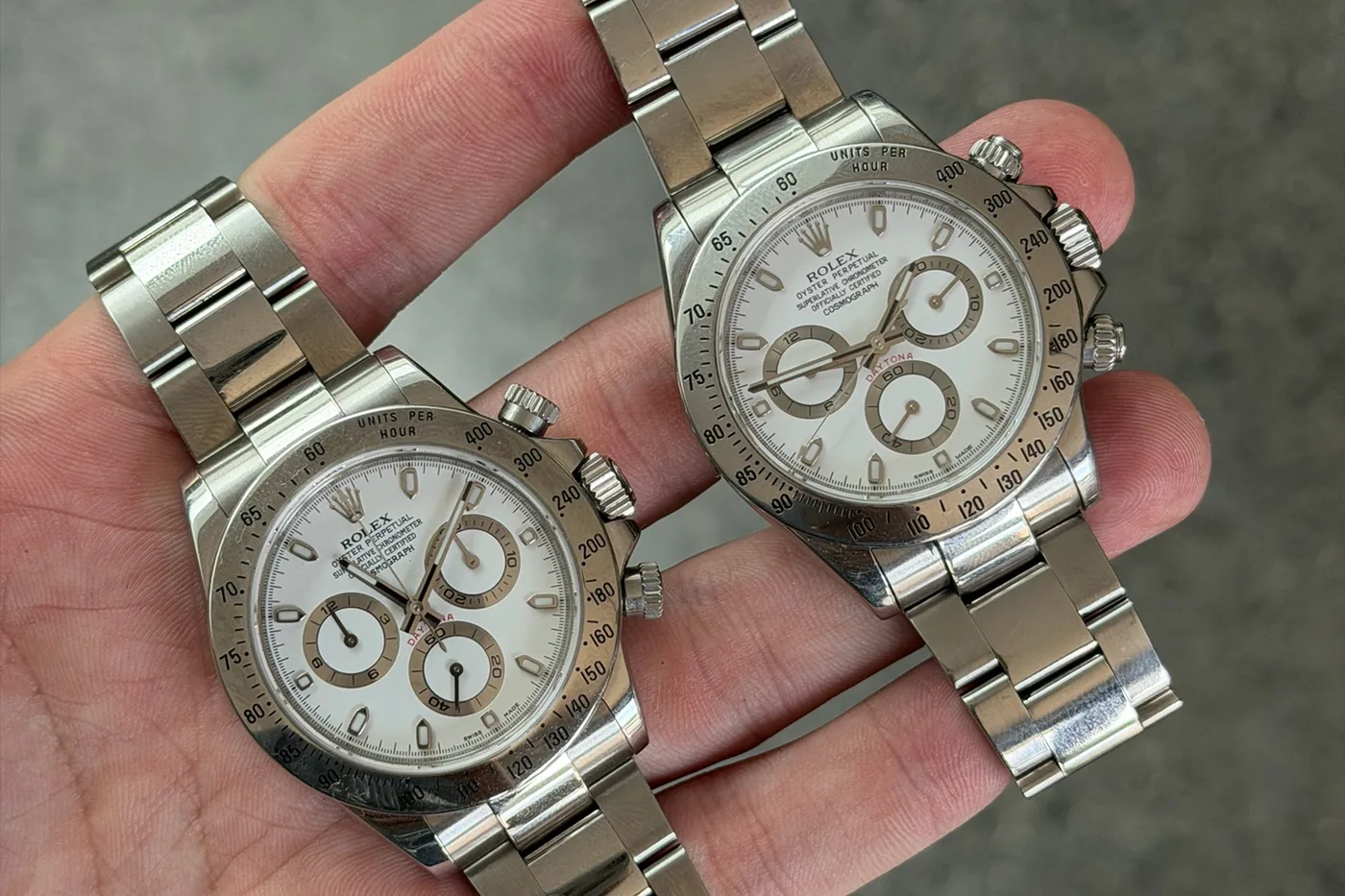 Two Rolex Daytona chronographs compared side by side during watch authentication in Sydney